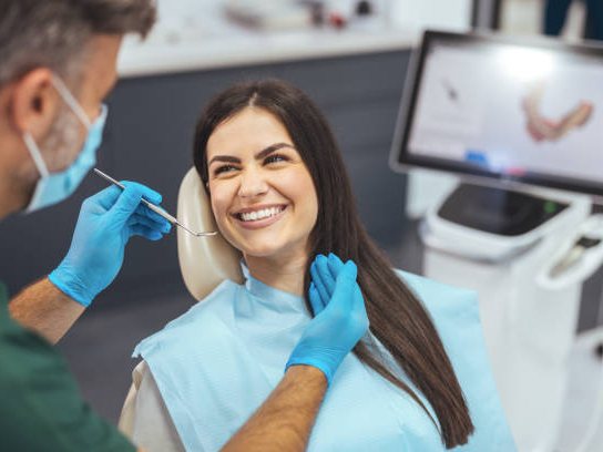 Dentist examining a patient's teeth in a modern dental clinic