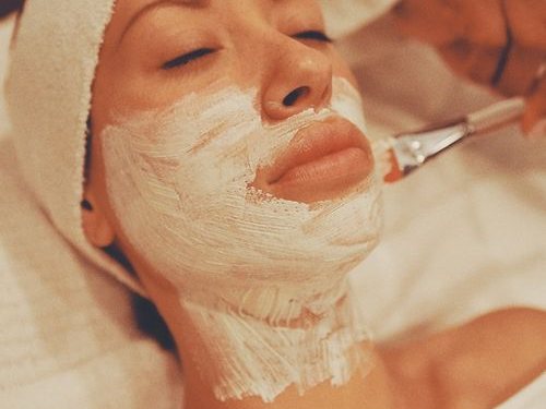 Woman enjoying a relaxing facial skincare treatment